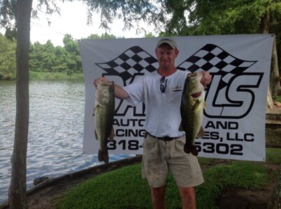 Man with large mouth bass at Lakeview Lodge