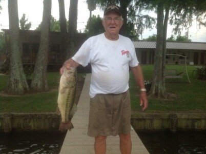 Man on dock at Lakeview lodge with Fish