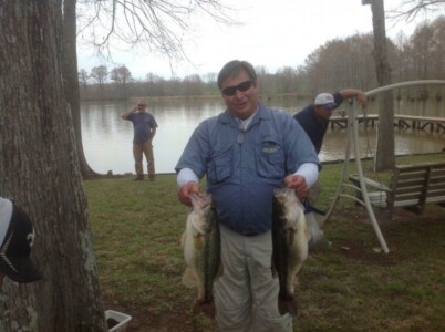 Man and two bass fish at Lakeview Lodge